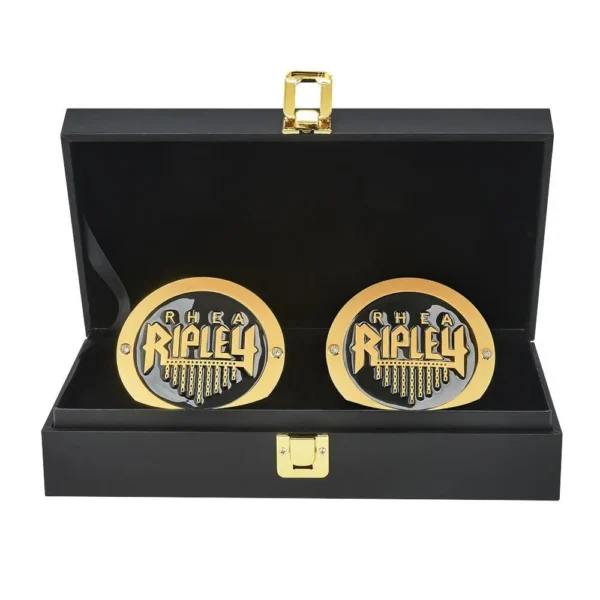 Rhea Ripley NXT UK side plates replica box set featuring gothic crest and enamel detail
