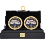Royal Rumble 2023 replica side plate box set featuring two brass WWE side plates in a black collector display case. Shop at TheChampions.biz